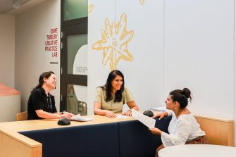 A team having an informal meeting at the Esme Timbery Creative Practice Lab