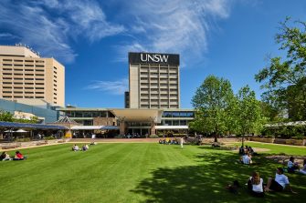 Students relaxing on Library lawn at Kensington UNSW.