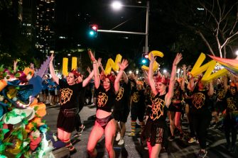 Photograph of peoplrin the mardi gras parade