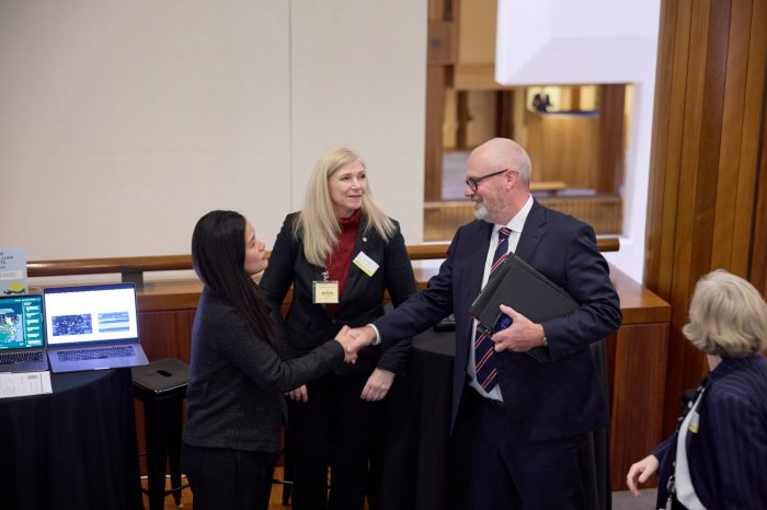 Federal Minister for Industry and Innovation Tim Ayres (right) speaking to Professor Flora Salim (right) and Dr Sue Keay (middle) at the event.
