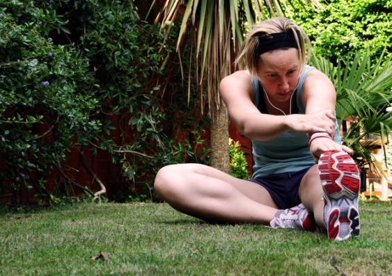 Some people believe stretching reduces the risk of injury, reduces soreness experienced after exercise, or enhances sporting performance. natalie/Flickr, CC BY-NC.