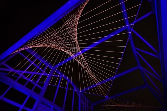 UNSW Art & Design students Elle van Uden and Ben Allen's light installation, Tye, is woven between the beams of a former WWI naval store