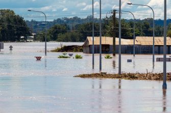 Bridge submerged in floodwaters
