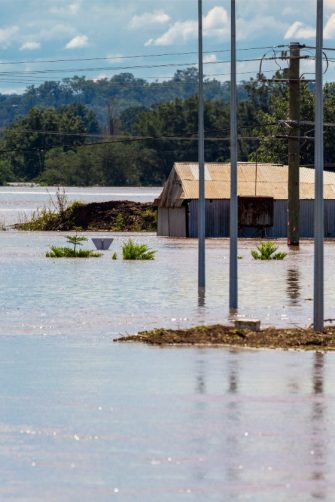 Bridge submerged in floodwaters