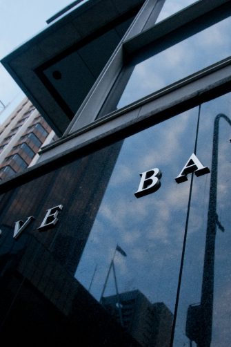 SYDNEY, AUSTRALIA - DECEMBER 6, 2015: Reserve Bank of Australia building name on black stone wall in the center of Sydney. Nobody is in the photo.