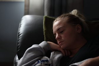 woman sleeping in armchair