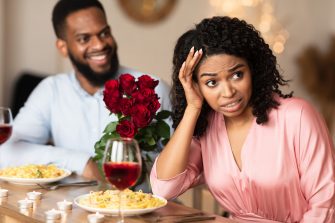 American little girl and boy explorer with his paper binoculars in the forest 