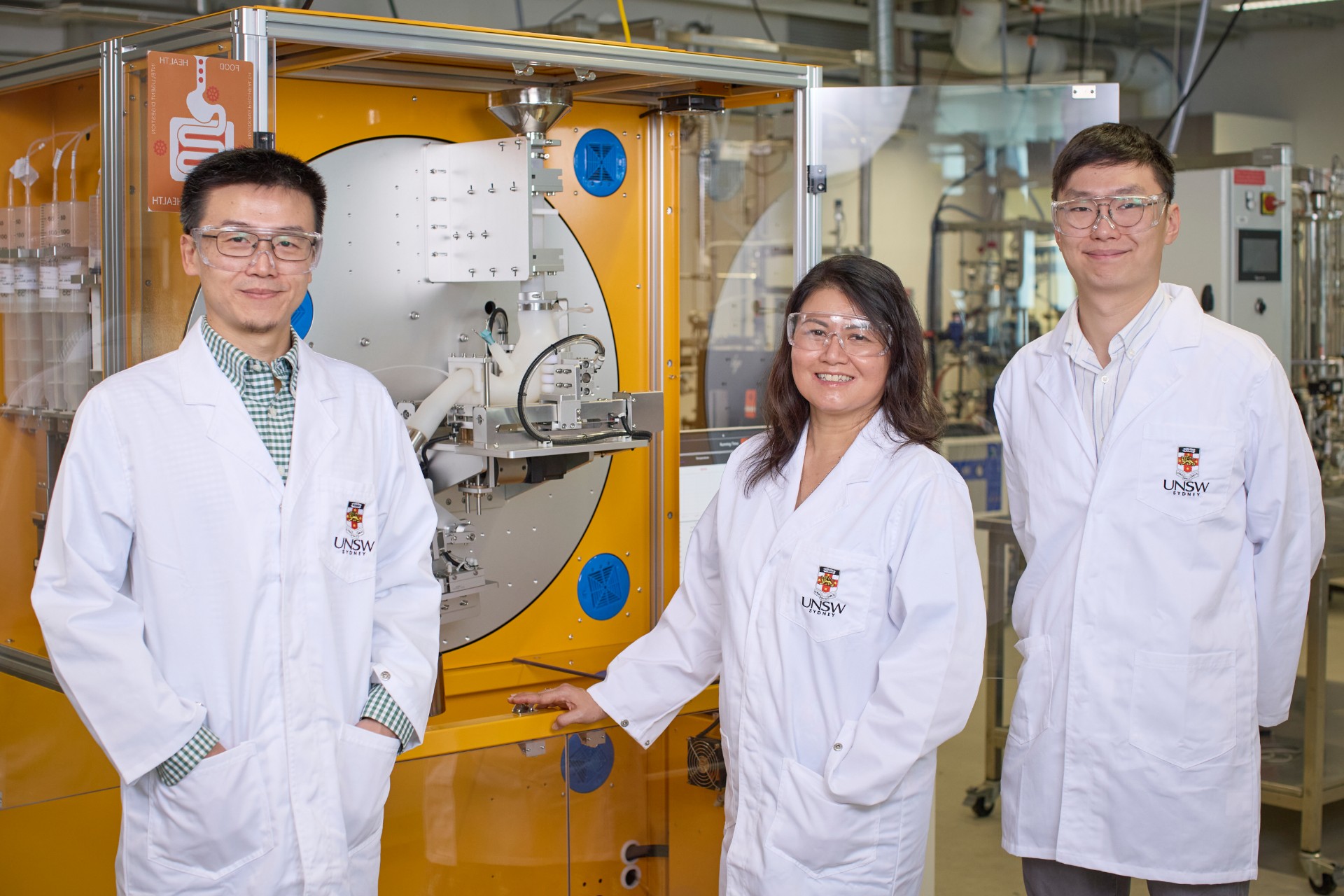 A photo of Yong Wang, Cordelia Selomulya and Canice Yiu in the food lab
