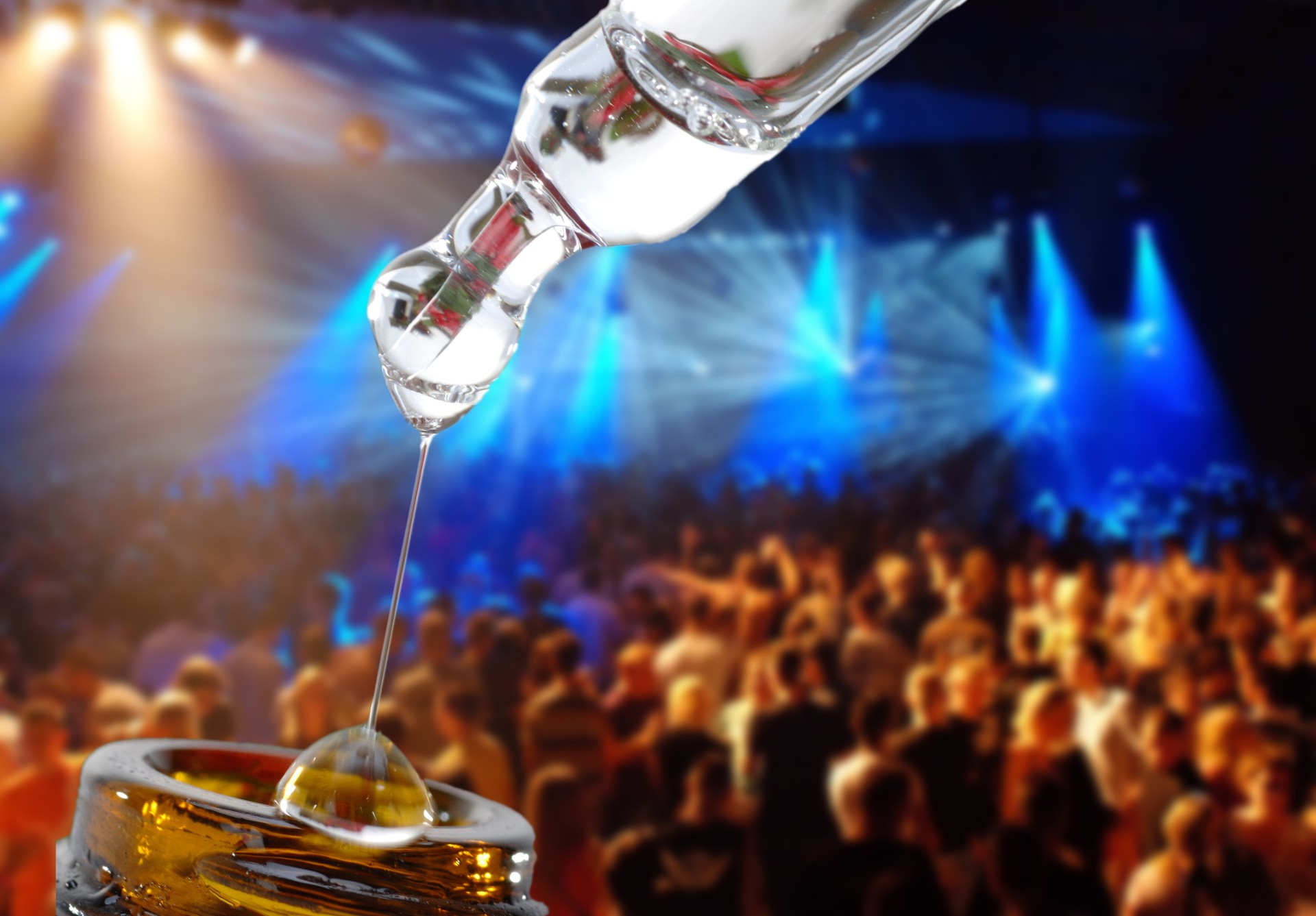 bottle of liquid drug imposed on a background of a rave