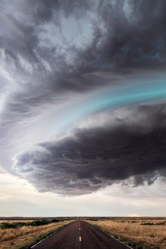 Huge hailstones after a severe thunderstorm in the hand of a young woman.