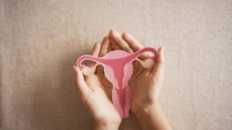 woman holding uterus, female reproductive system , woman health, PCOS, gynecologic and cervix cancer concept