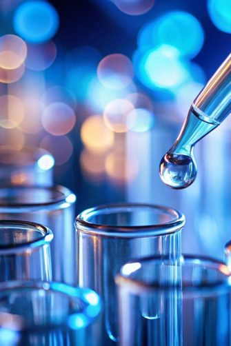 Vibrant and colorful close-up of laboratory test tubes with a liquid dropper Represents a scientific experiment conducted possibly in a medical or chemical laboratory setting