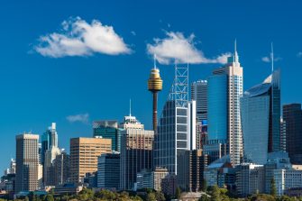 Sydney skyline with Sydney Tower and Sydney Business District skyscrapers on sunny day. Modern cityscape