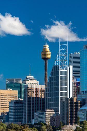 Sydney skyline with Sydney Tower and Sydney Business District skyscrapers on sunny day. Modern cityscape