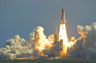 A space shuttle takes off.
