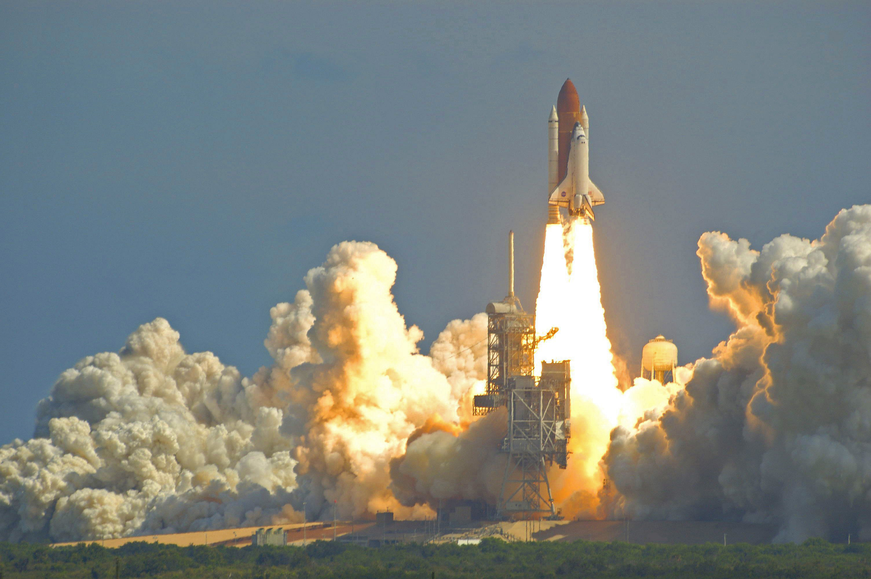 A space shuttle takes off.