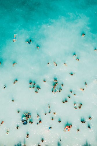 Aerial Summer View Of Clear Ocean Water Full Of Tourists