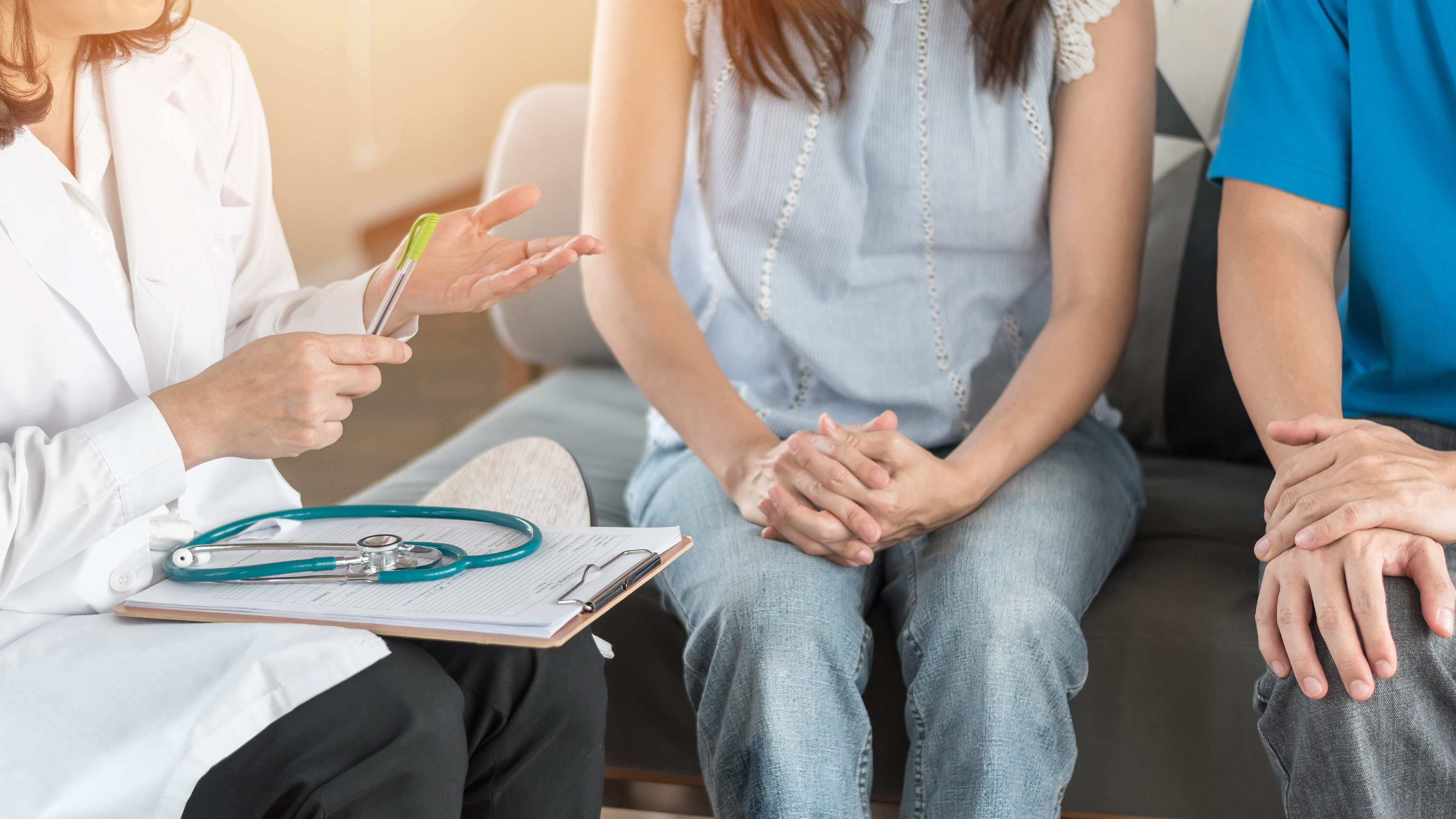 A couple have a consult with a doctor. 