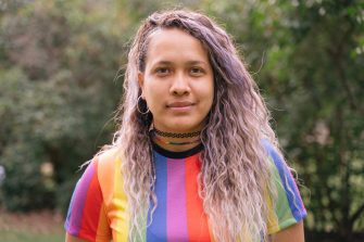 Teen lesbian woman wearing proudly the lgbt flag colors.
