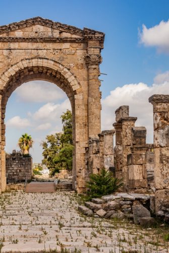 Monumental arch and Roman road at Al Bass archaeological site in Tyre, Lebanon