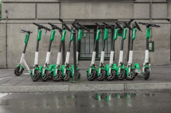 Dedicated place to park rental electric scooters in the city, with visible floor markings to denote boundaries of parking spot.