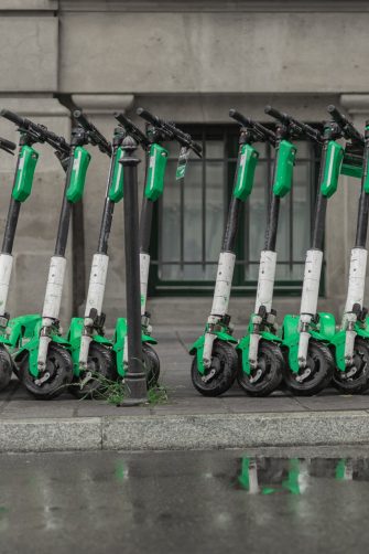 Dedicated place to park rental electric scooters in the city, with visible floor markings to denote boundaries of parking spot.