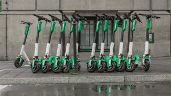 Dedicated place to park rental electric scooters in the city. of krakow, poland, with visible floor markings to denote boundaries of parking spot.