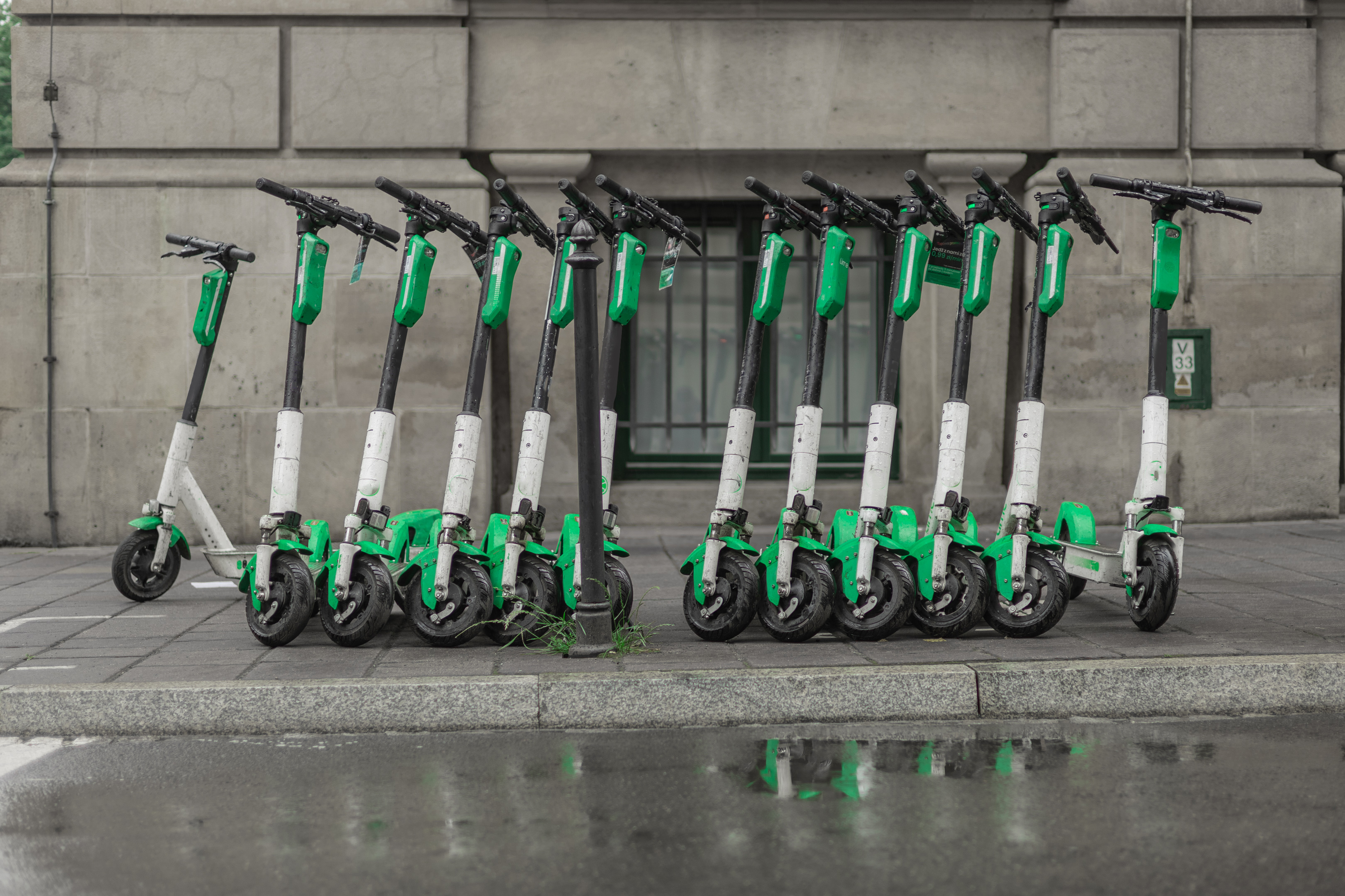 Dedicated place to park rental electric scooters in the city, with visible floor markings to denote boundaries of parking spot.