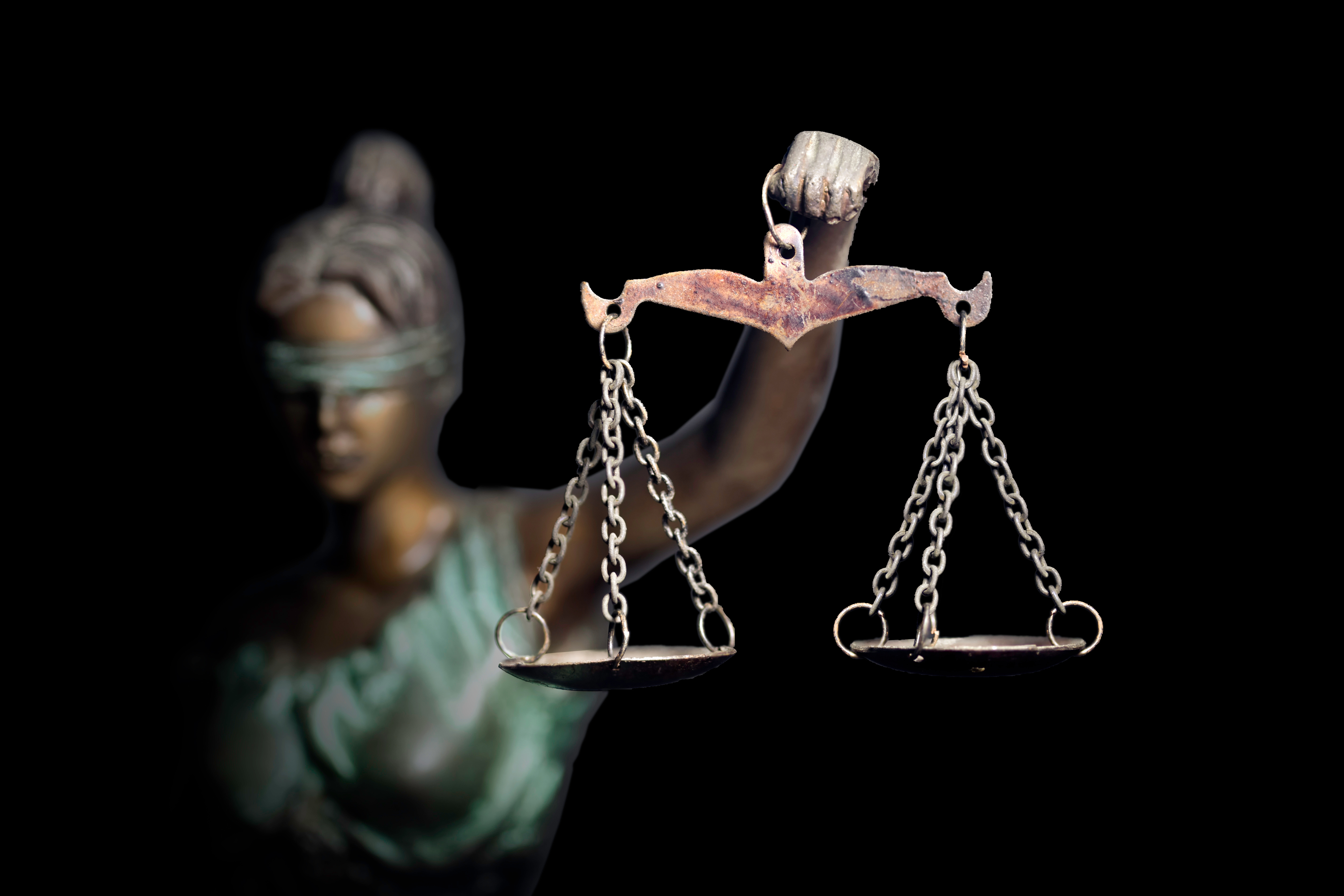 Lady Justice or Themis (God of Justice) holding scales of justice