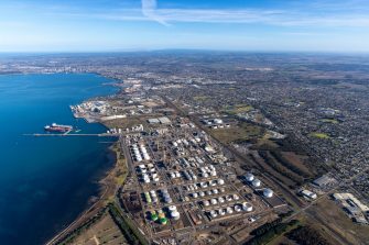 Aerial view of Geelong Energy Hub, oil refinery and LNG gas terminal in Corio Bay, Victoria Australia