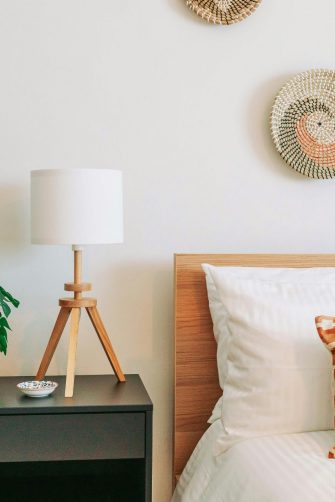Styled bedroom with orange cushions