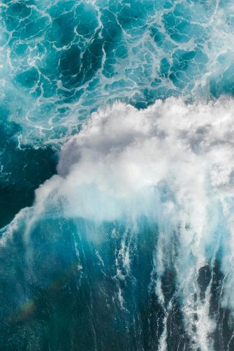 Aerial view of waves crashing in ocean