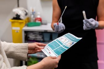 STI sample being collected in a medical setting