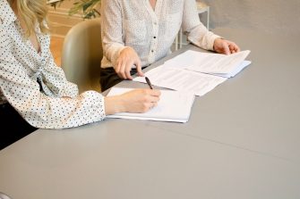 Business women looking at documents