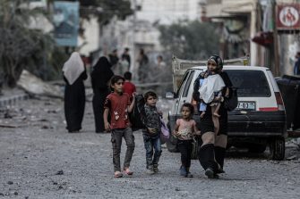 GAZA CITY, GAZA - OCTOBER 16: Palestinians carrying belongings flee to safer areas following Israeli bombardments on southern part of Gaza City, Tel al-Hawa neighborhood, Gaza on October 16, 2023. (Photo by Ali Jadallah/Anadolu via Getty Images)