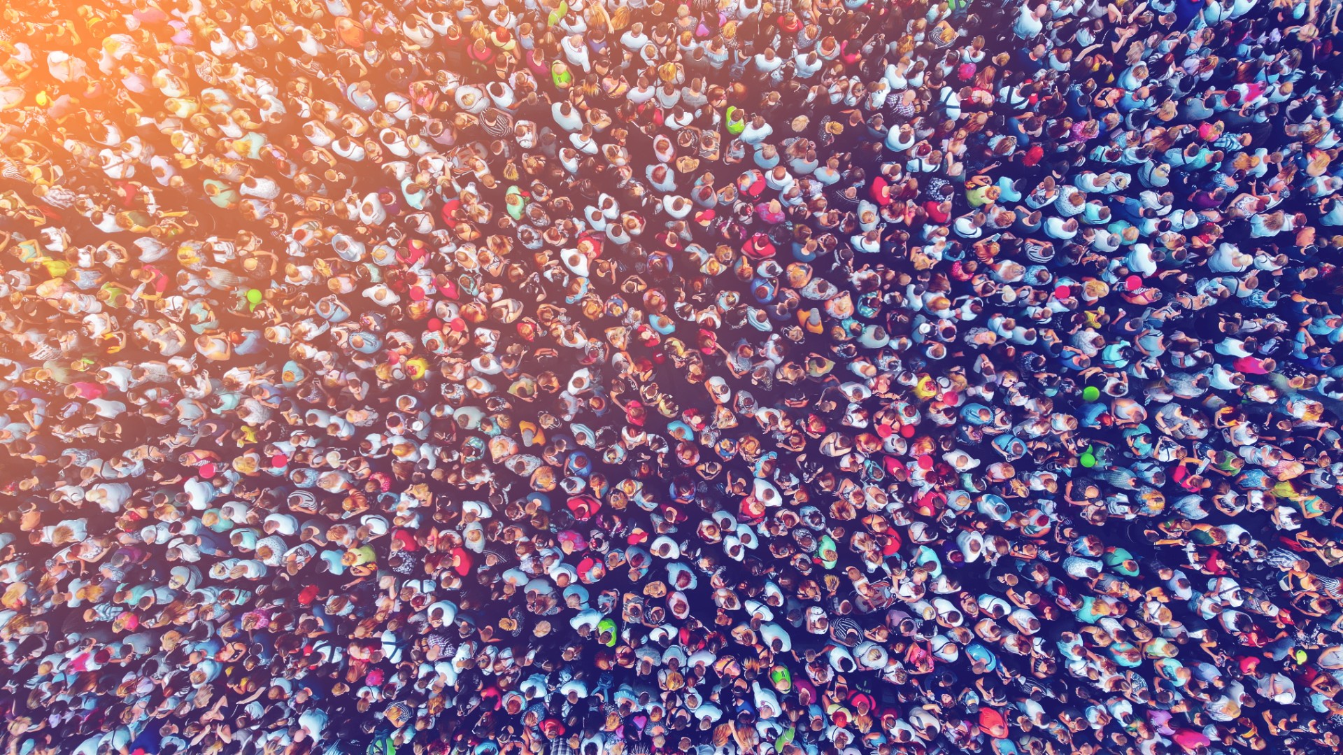 Aerial. Big crowd of people. People gathered together in one place. Top view from drone. Image with flare effect.