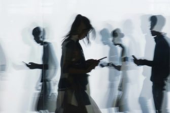 A couple of teenagers scrolling on their phones in claymation style. Generated by AI.