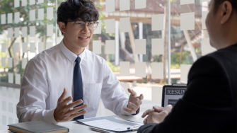 Asian male student at a job interview