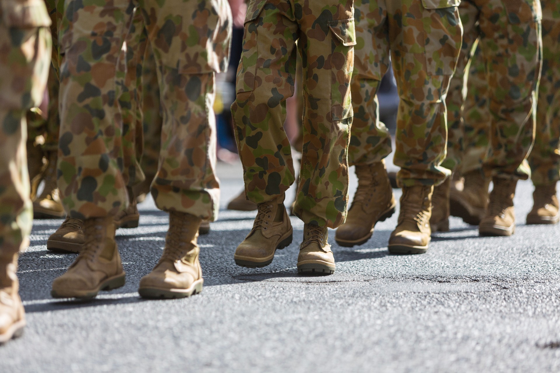 Close-up of the legs and boots of Australian soldiers marching