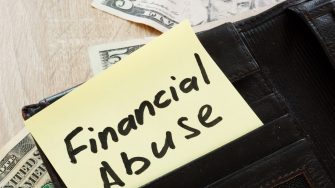 Open wallet with words Financial abuse.