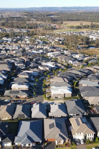 For lease sign on a blue display outside of a resedential building in Australia. Investment property real estate concept