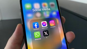 Social media app icons on a mobile phone screen stock