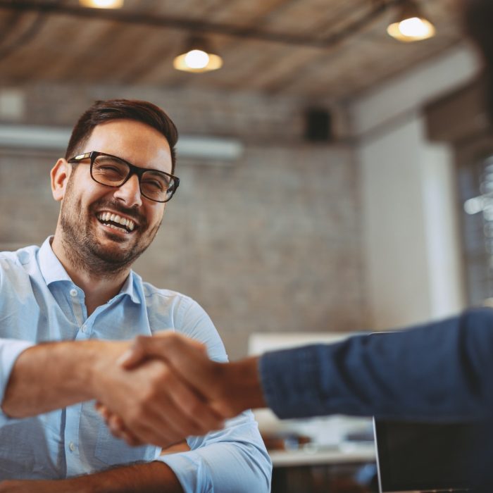 Close up of handshake in the office