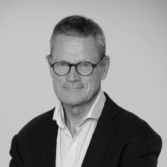 A black and white headshot of Michael Traill, who is an Industry Fellow at UNSW CSI.