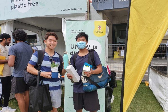 Two students standing in front of Plastic Free UNSW O-Week Stall