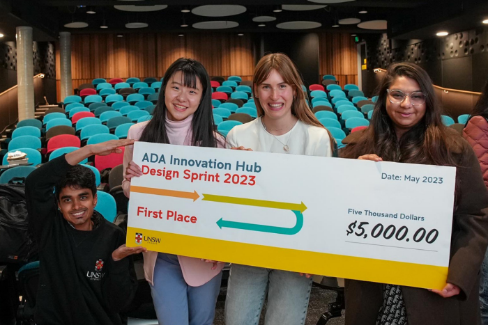 First place winning team from ADA Innovation Hub Design Sprint 2023 hold giant novelty cheque