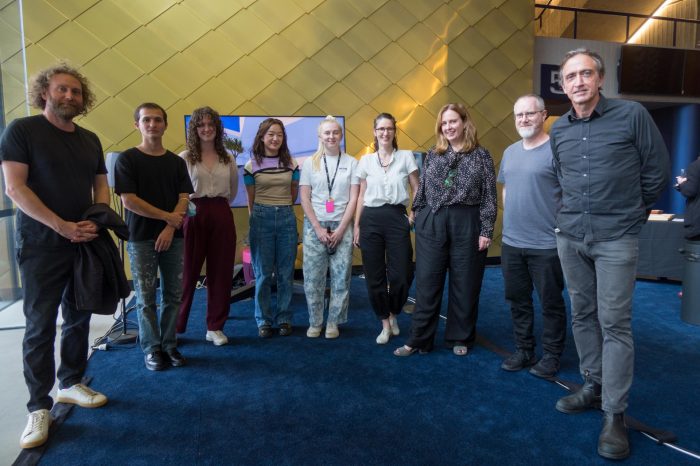 Breathe team in front of their artefact model presentation