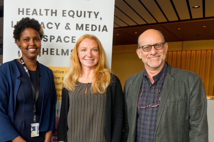 HELMS team in front of their project presentation