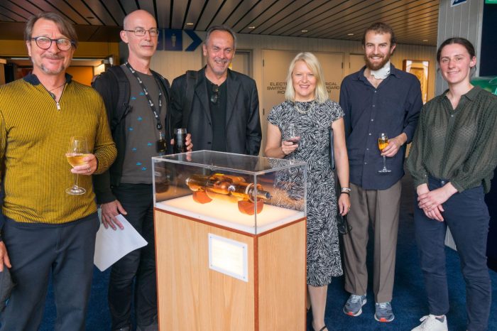 Site First team in front of their artefact model presentation