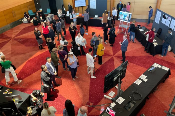 A group of people at an exhibition showcase